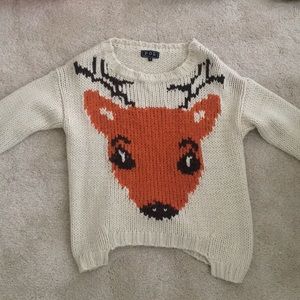 Off white, thick knit sweater with a deer on it
